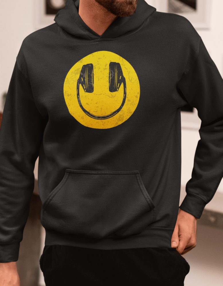 Black hoodie with yellow smiley face wearing headphones