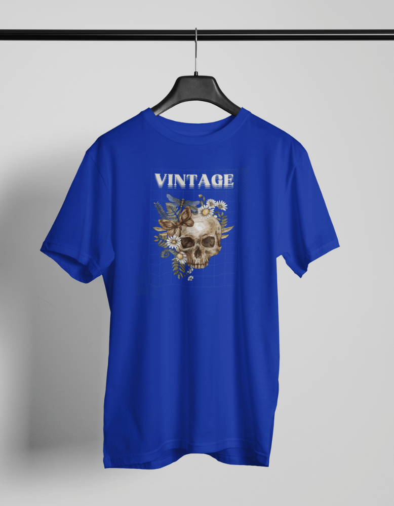 Blue t-shirt with vintage skull surrounded by flowers and the word VINTAGE above